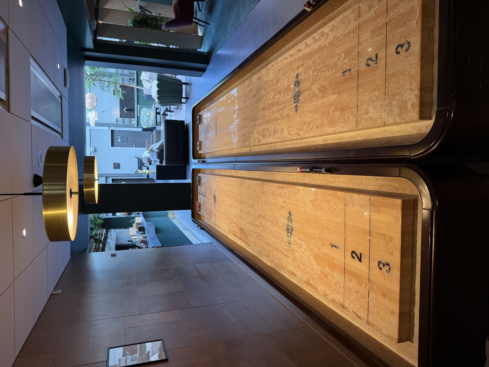 Two shuffleboard tables in the lounge