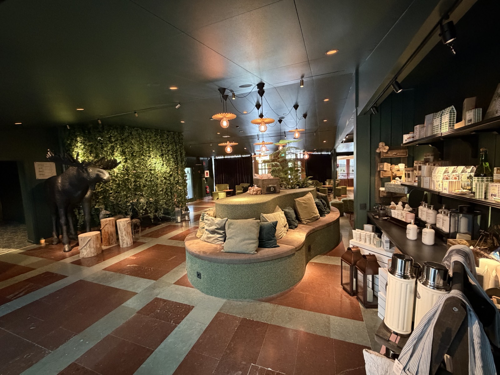Reception at Sånga-Säby, with the moose and the green plant wall